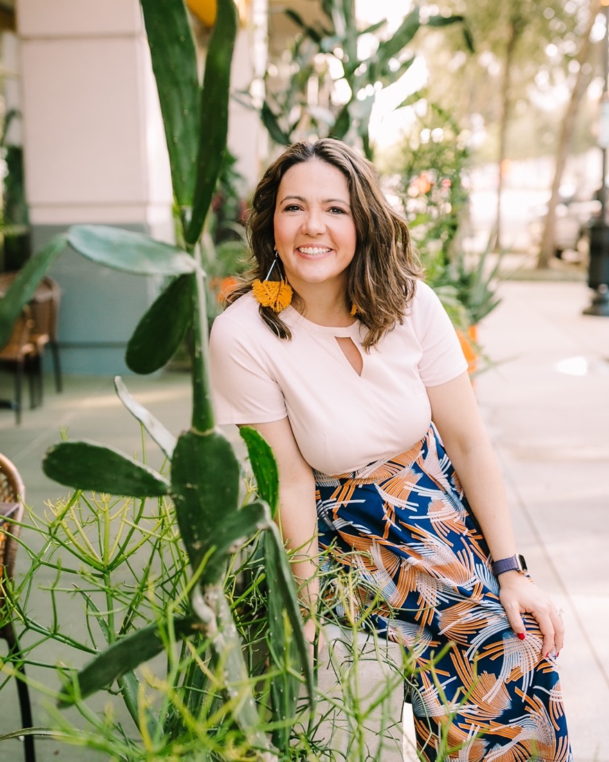 Renee Seltzer smiling on a sidewalk in Orlando